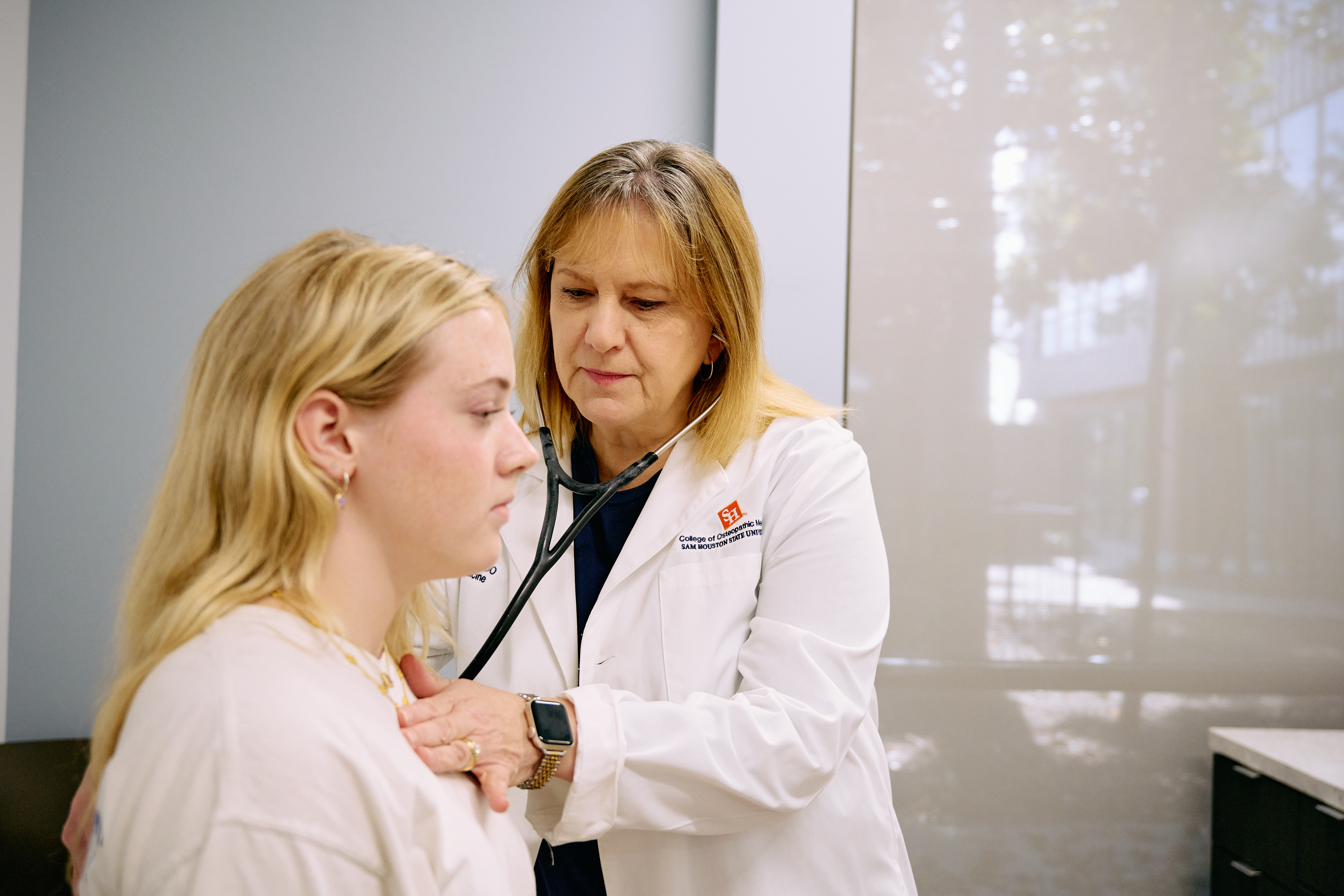 Physician listens to a patient’s heartbeat during a checkup at SHSU Physicians.