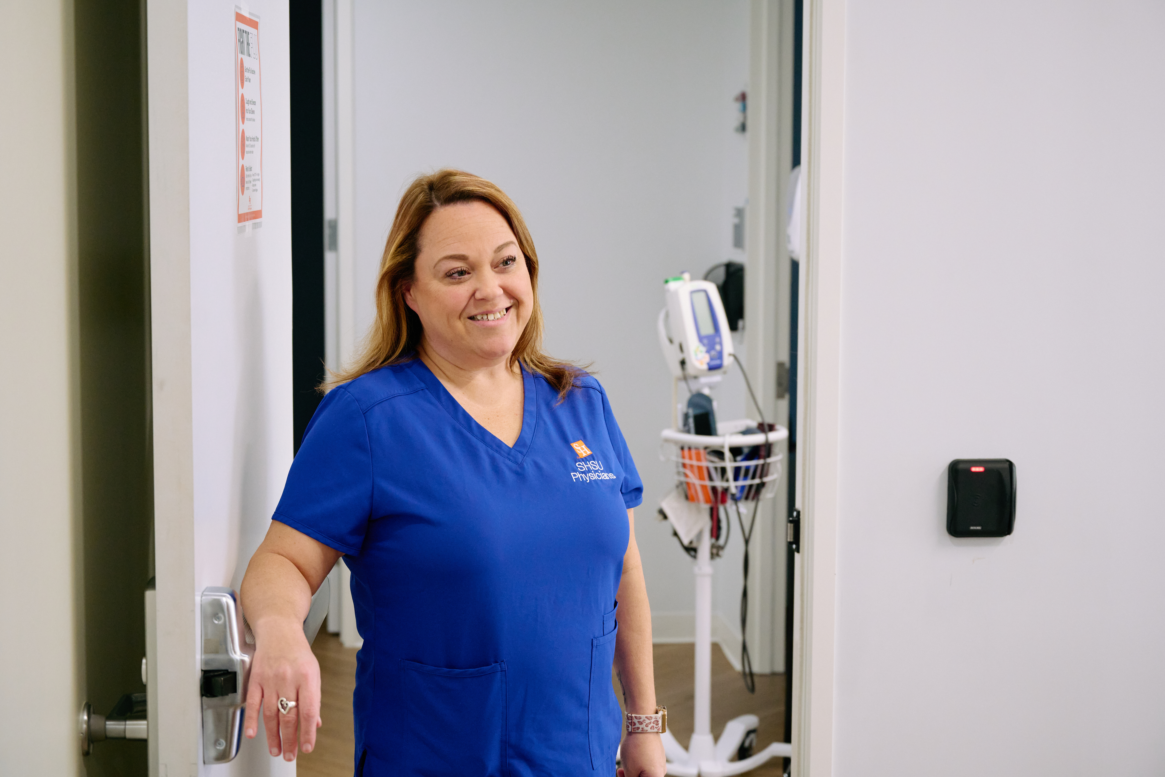 Nurse calling a patient back to see a physician