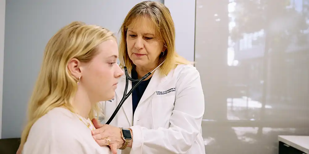 doctor listening to patient heart